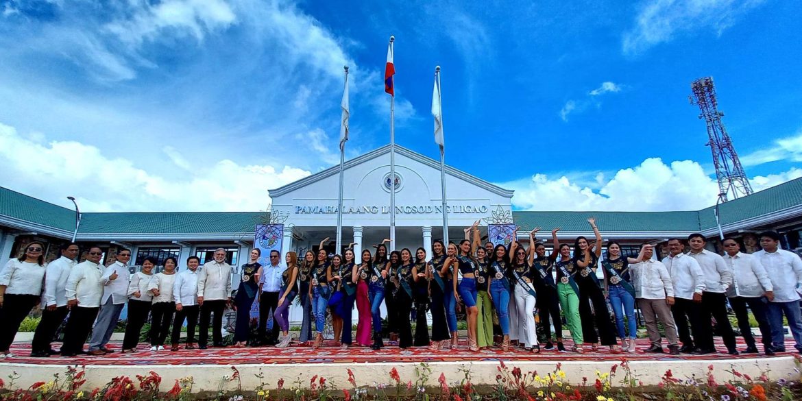 Miss Earth candidates take a photo with local officials in front of Ligao City Hall before the preliminary competition scheduled on Monday (Nov. 21) evening.