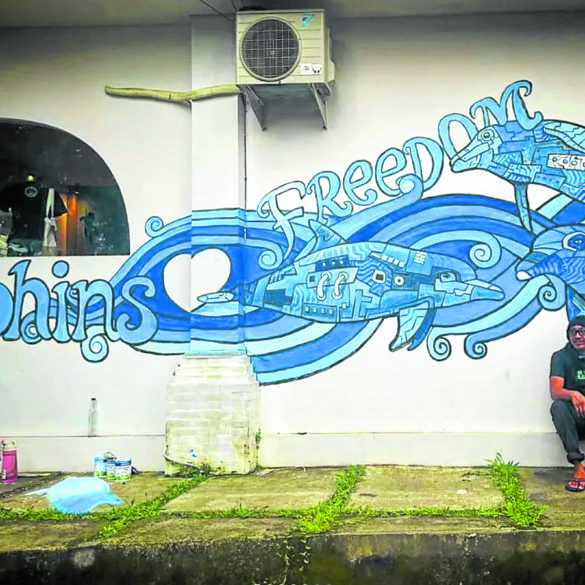 The artist with the recently completed mural no. 1,000 in Bali, Indonesia —@whaleboy2000 Instagram