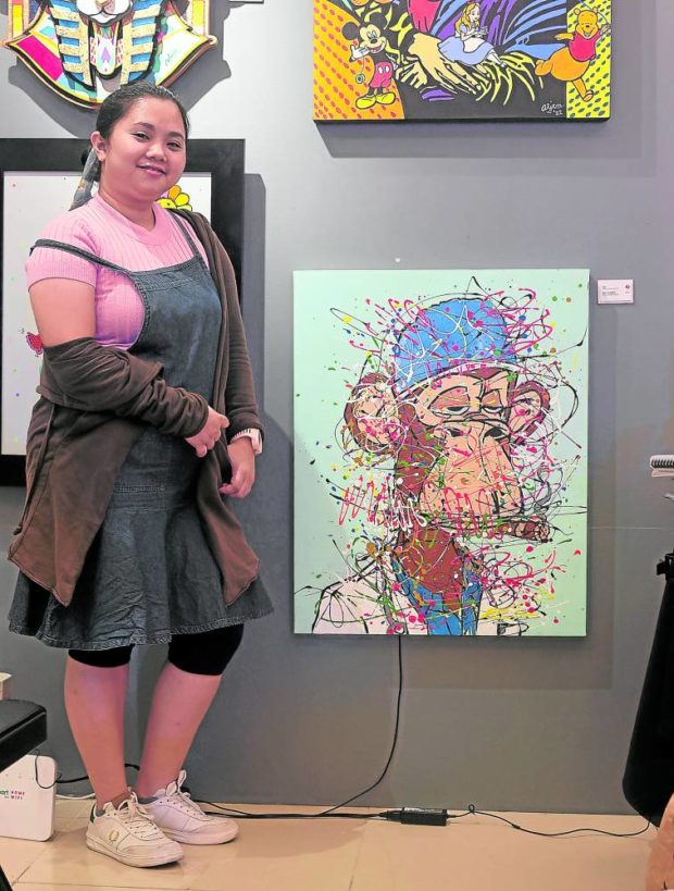 Artist Jori poses with her augmented reality art.  