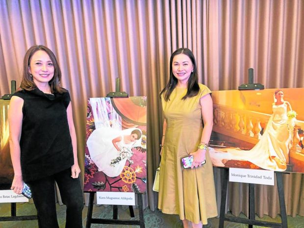 Kara Magsanoc-Alikpala and Monique Trinidad-Toda with their wedding portraits in Auggie gowns