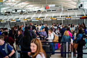 Travelers wait to check in at John F. Kennedy International Airport in New York City, U.S., April 6, 2023. REUTERS/Eduardo Munoz