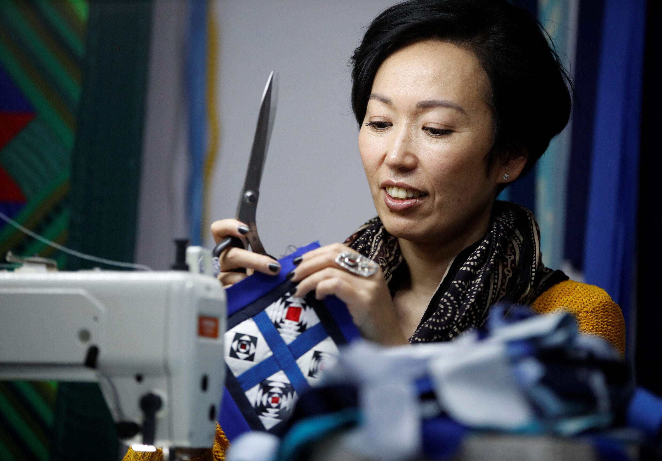 Kyrgyz artist and environmental activist Cholpon Alamanova sews in her workshop in Bishkek