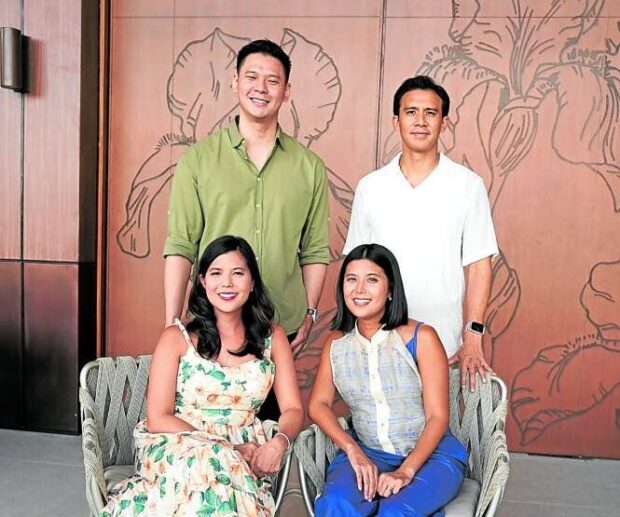 Camille and Nicole(seated)
with their husbands Tim Ng (left) and Miko De Los Reyes