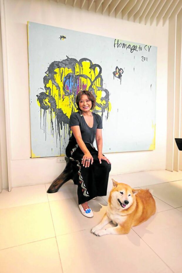 Ces Oreña-Drilon and her Shiba Inu Dymka in front of “Homage to Cy” by BerniePacquing —PHOTOS BY EUGENE ARANETA