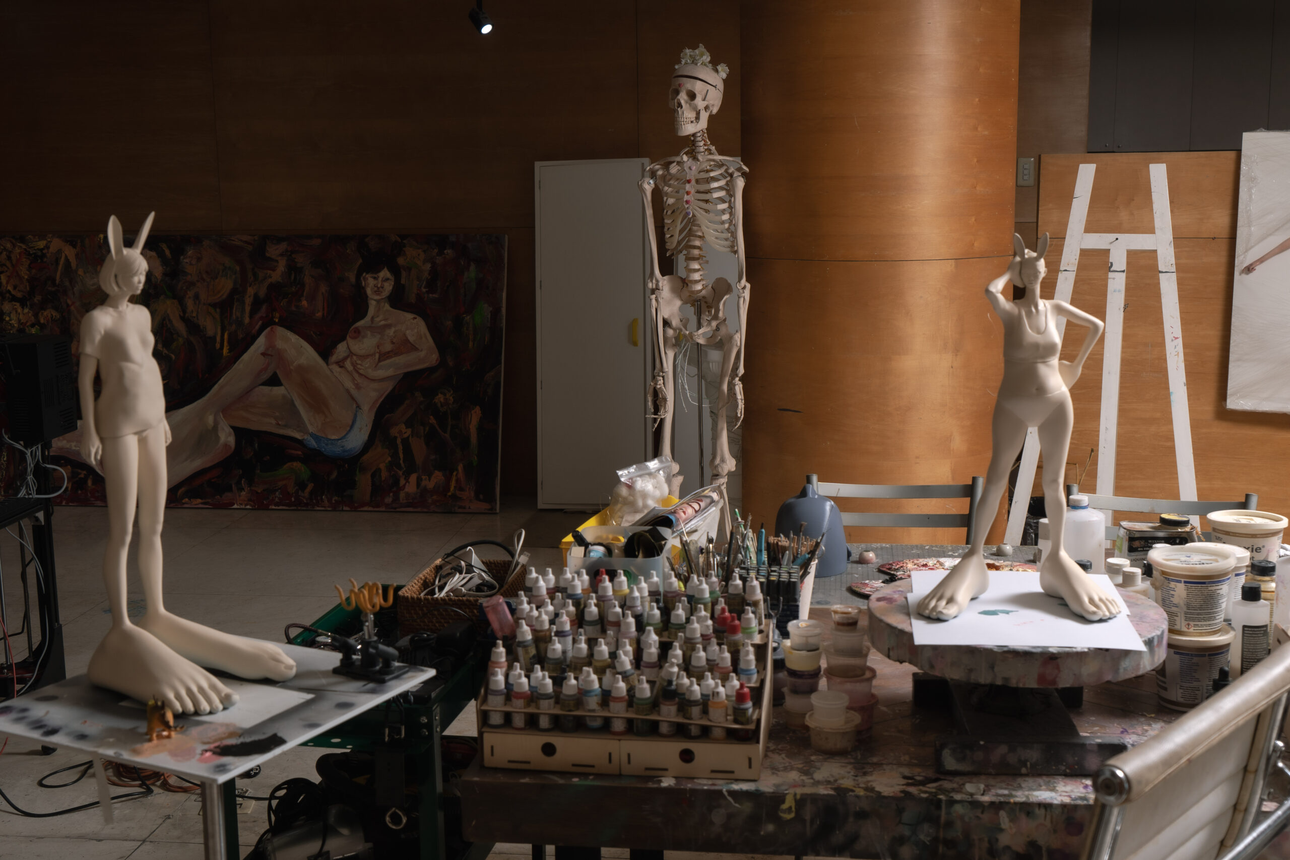 Skeleton with sculptures in art studio