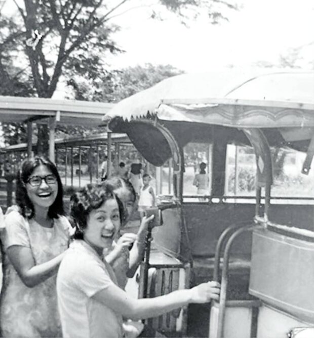 The author and Nena De Leon-Paler are first in line in the “ikot” jeep, the fastest mode of transport from building to building. The fare for one ride in the ’70s was 5 centavos.
