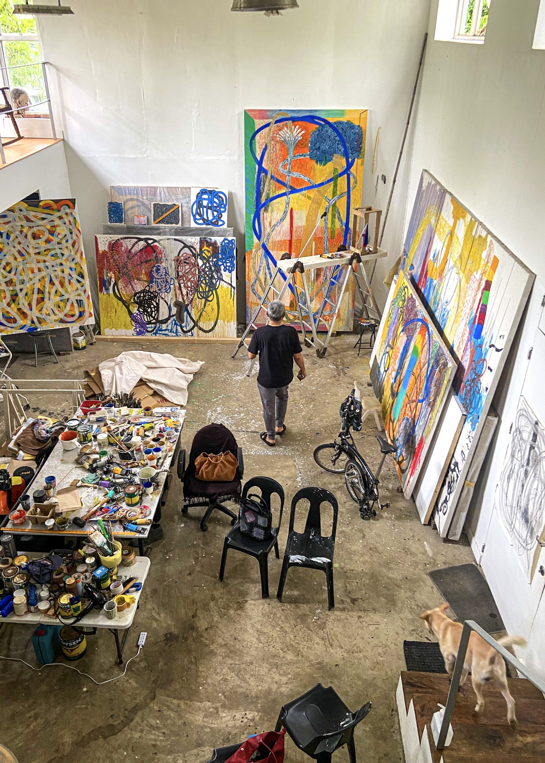man in colorful art studio