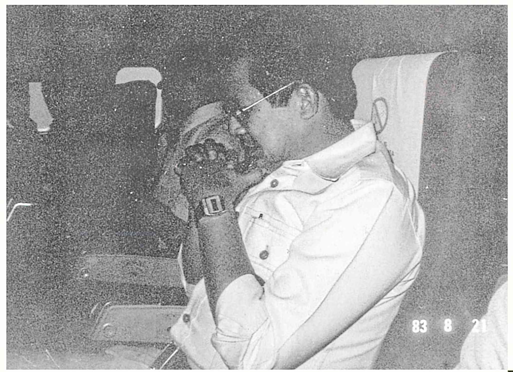 Ninoy praying the rosary in his airplane seat on Aug. 21, 1983.