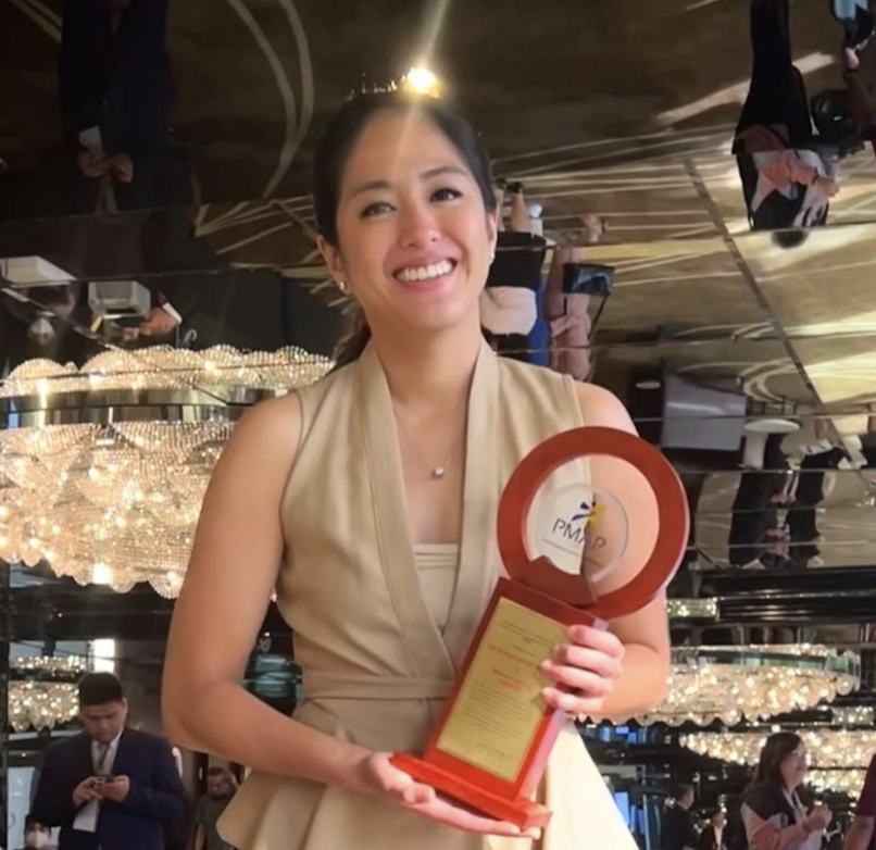 Gretchen Ho poses with the trophy awarded to "Woman in Action." Image: Instagram/@gretchenho