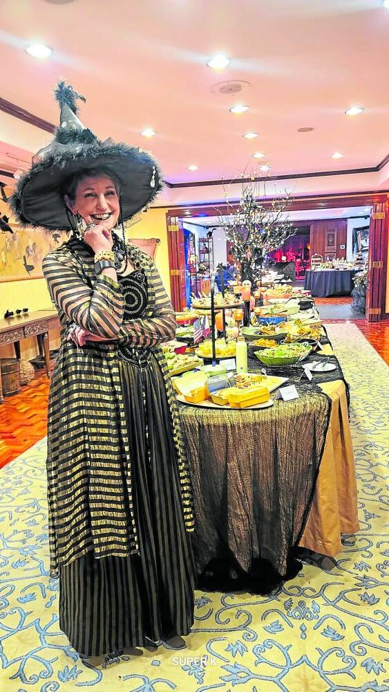 US Ambassador MaryKay Carlson as an everyday witch with her Halloween table —PHOTOS by RUTH L. NAVARRA