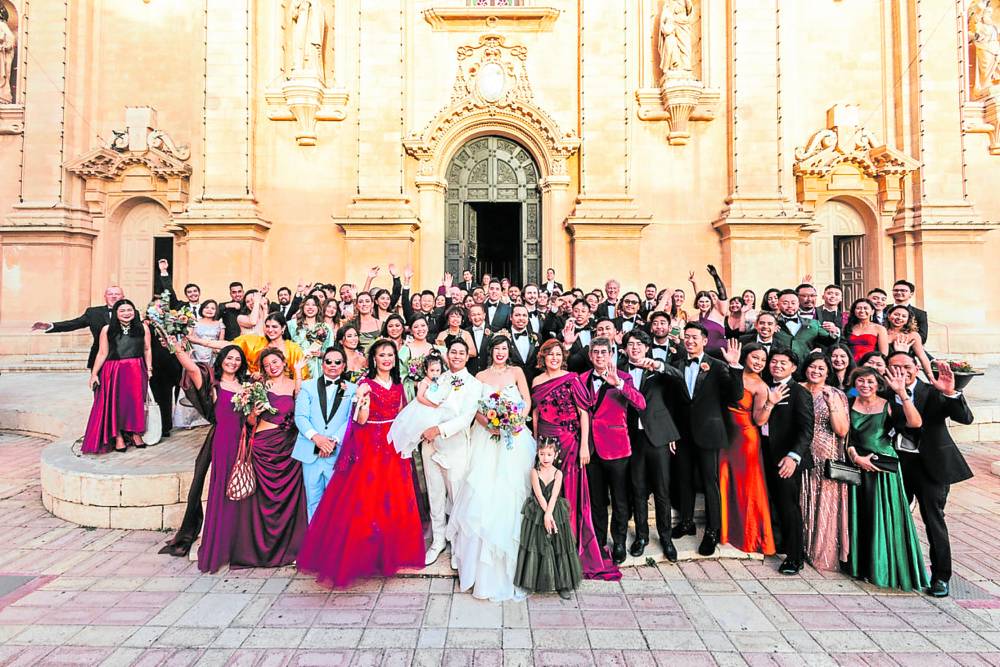 Oliver Gallego and Audrey Prieto surrounded by family and friends who traveled from all over the world to attend their wedding in Malta.