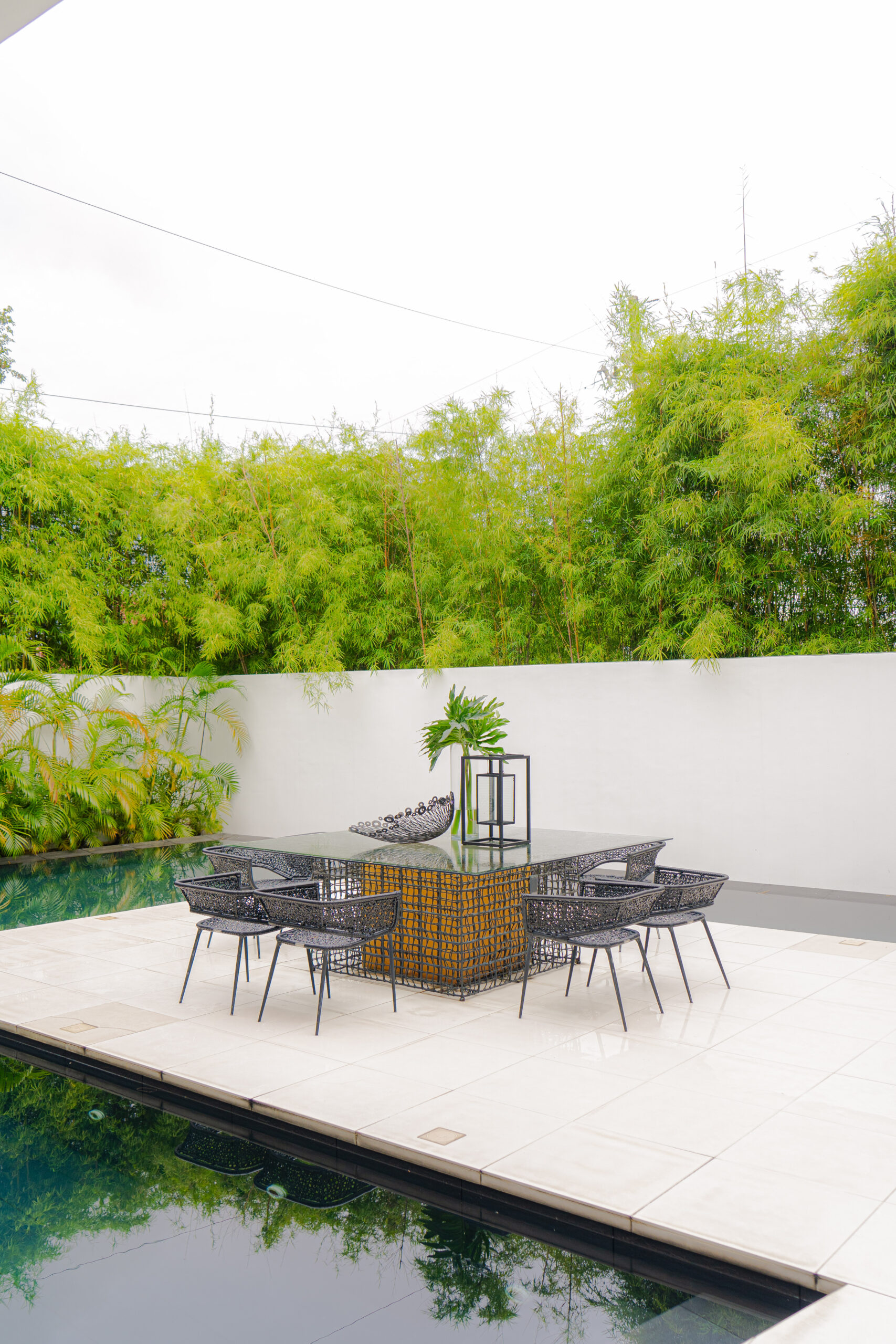 The pool, which surrounds the outdoor sitting area and parts of the living room, is a perfect spot to entertain guests
