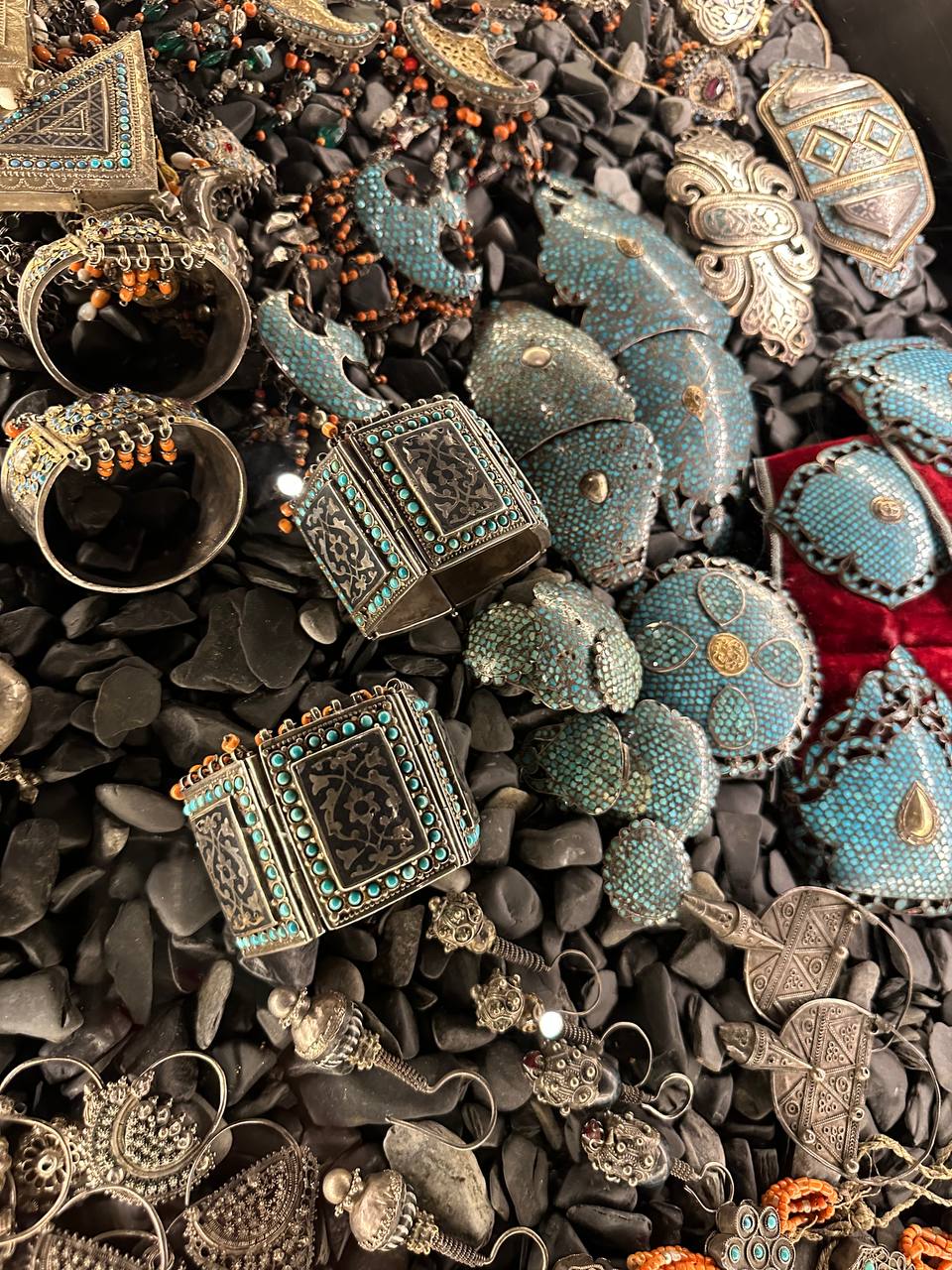 An assortment of bracelets, cuffs, and earrings from Le Monde des Arts de la Parure