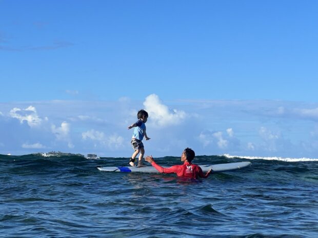 Louie Prieto and surf instruc-tor Darud Boticario