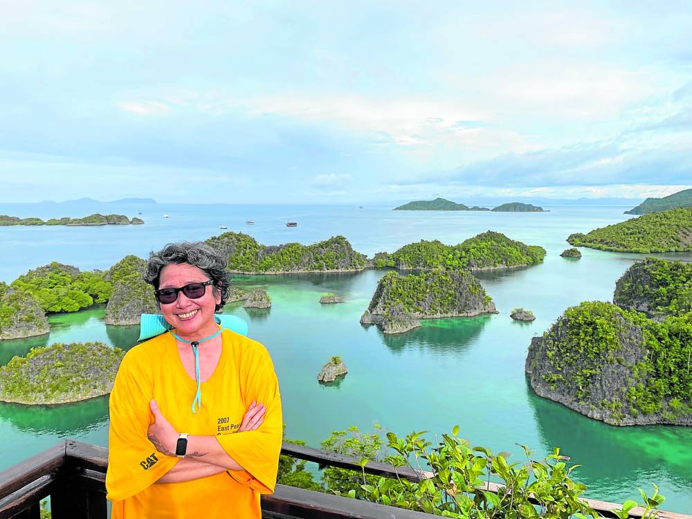 The author at the Piaynemo viewpoint, with the most famous vista of Raja Ampat (Photo: Christine Enrile-Chua)