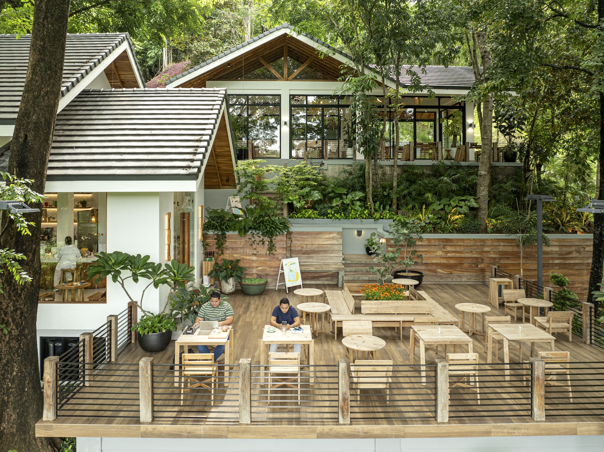 A Slow Life Coffee is nestled among teak trees at the foot of a mountain