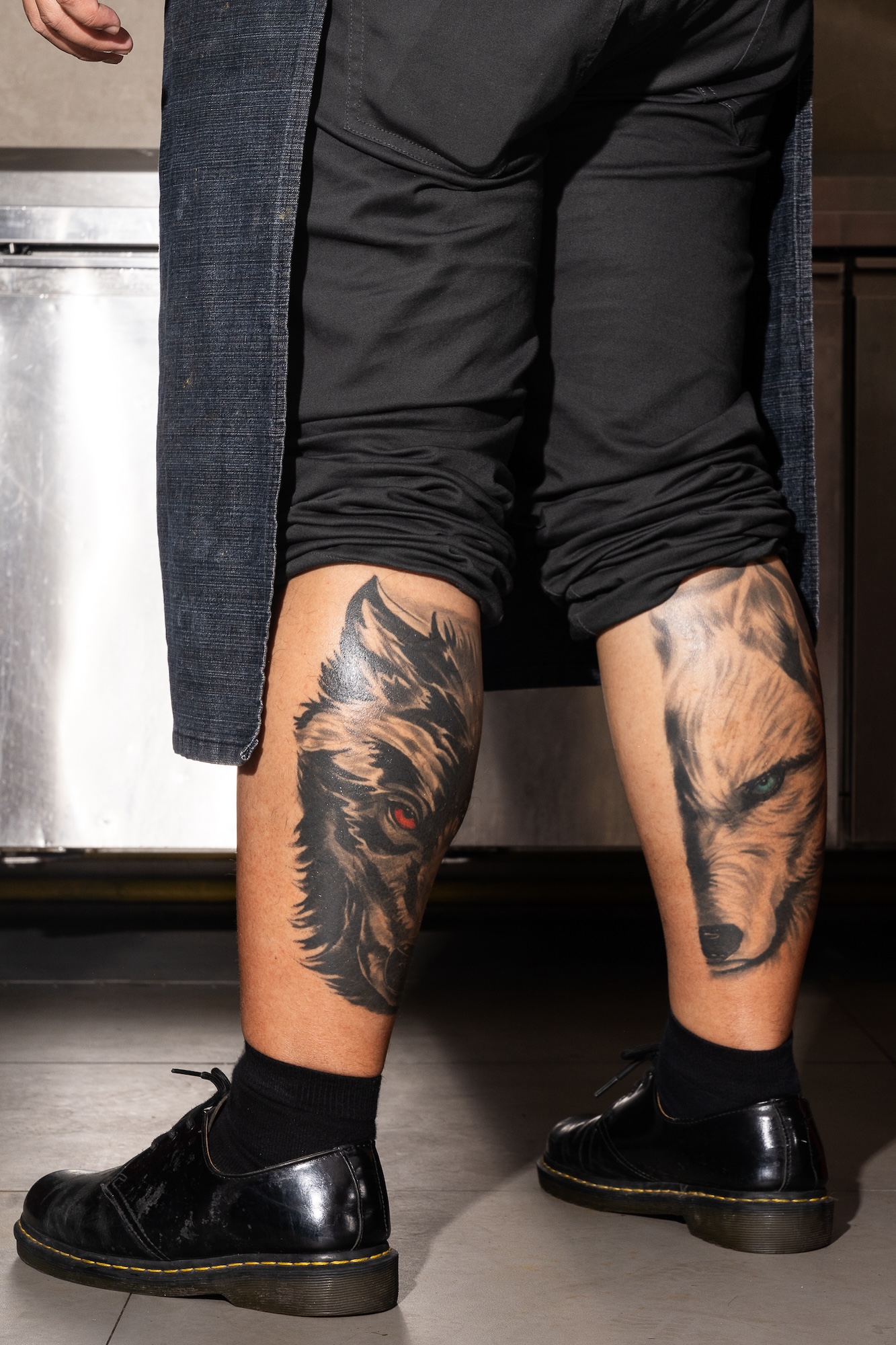 The black and white wolf tattoos symbolizing the yin and yang of Rej Casanova