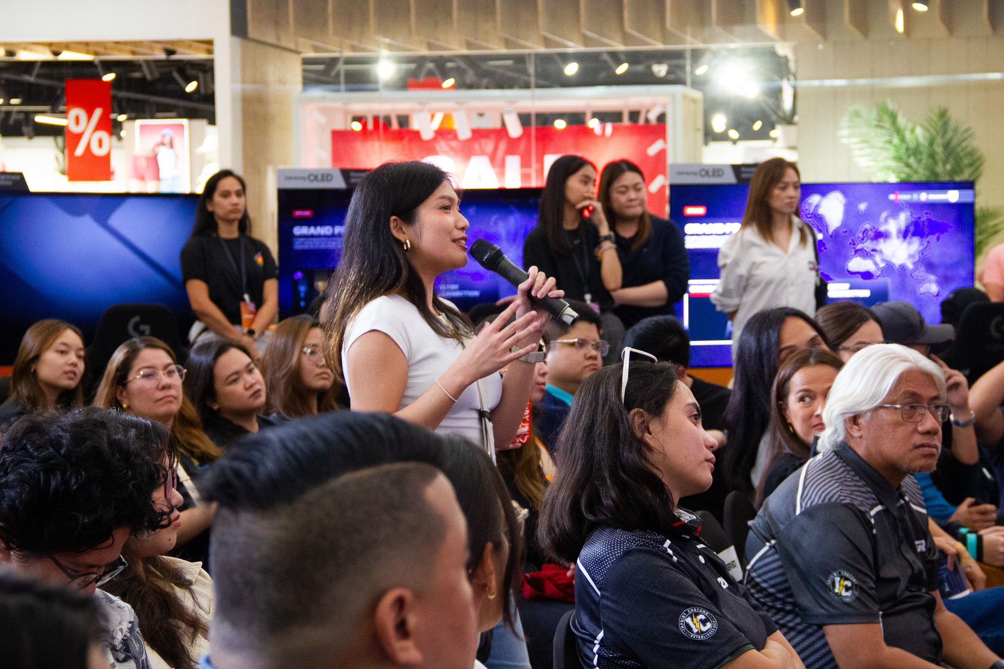 A guest asks the panelists a question during the Q&A portion of the talk.