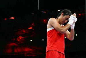 Algeria's Imane Khelif celebrates her victory over Hungary's Anna Luca Hamori in the women's 66kg quarter-final boxing match during the Paris 2024 Olympic Games at the North Paris Arena, in Villepinte on August 3, 2024. (Photo by MOHD RASFAN / AFP)