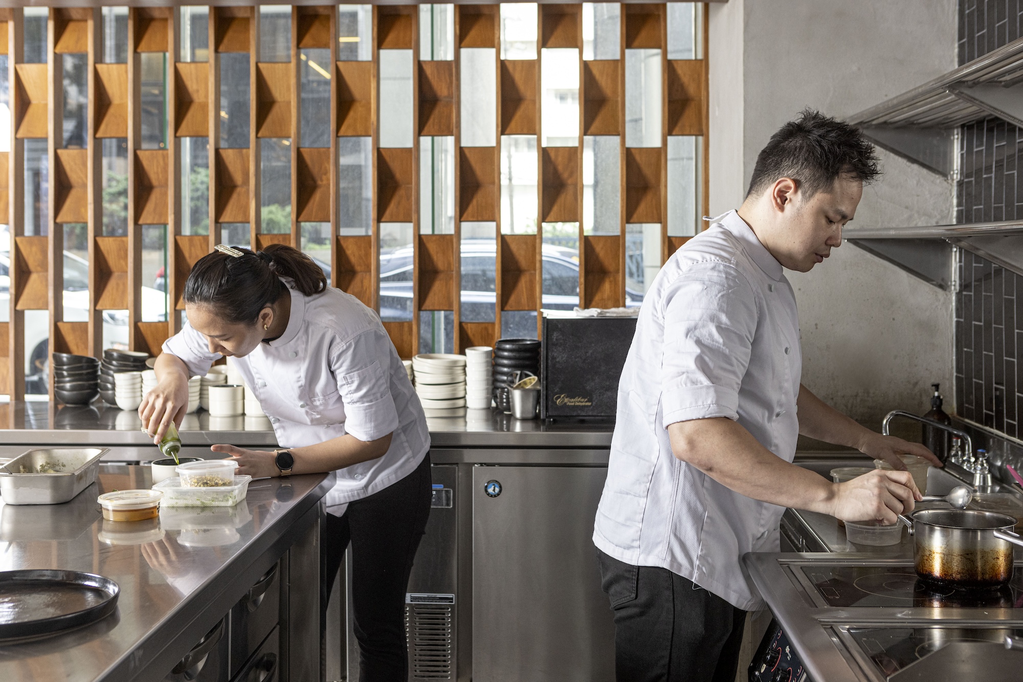 Chefs Mikee Lopez and Alex Tan at work