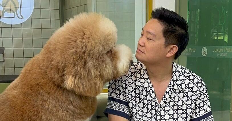 Dr Z Teo and his giant poodle Oslo