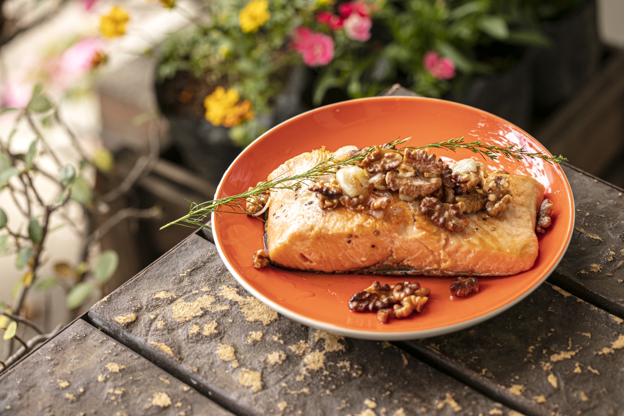 Pan-grilled salmon with walnuts: Salmon is packed with protein while walnuts promote gut health