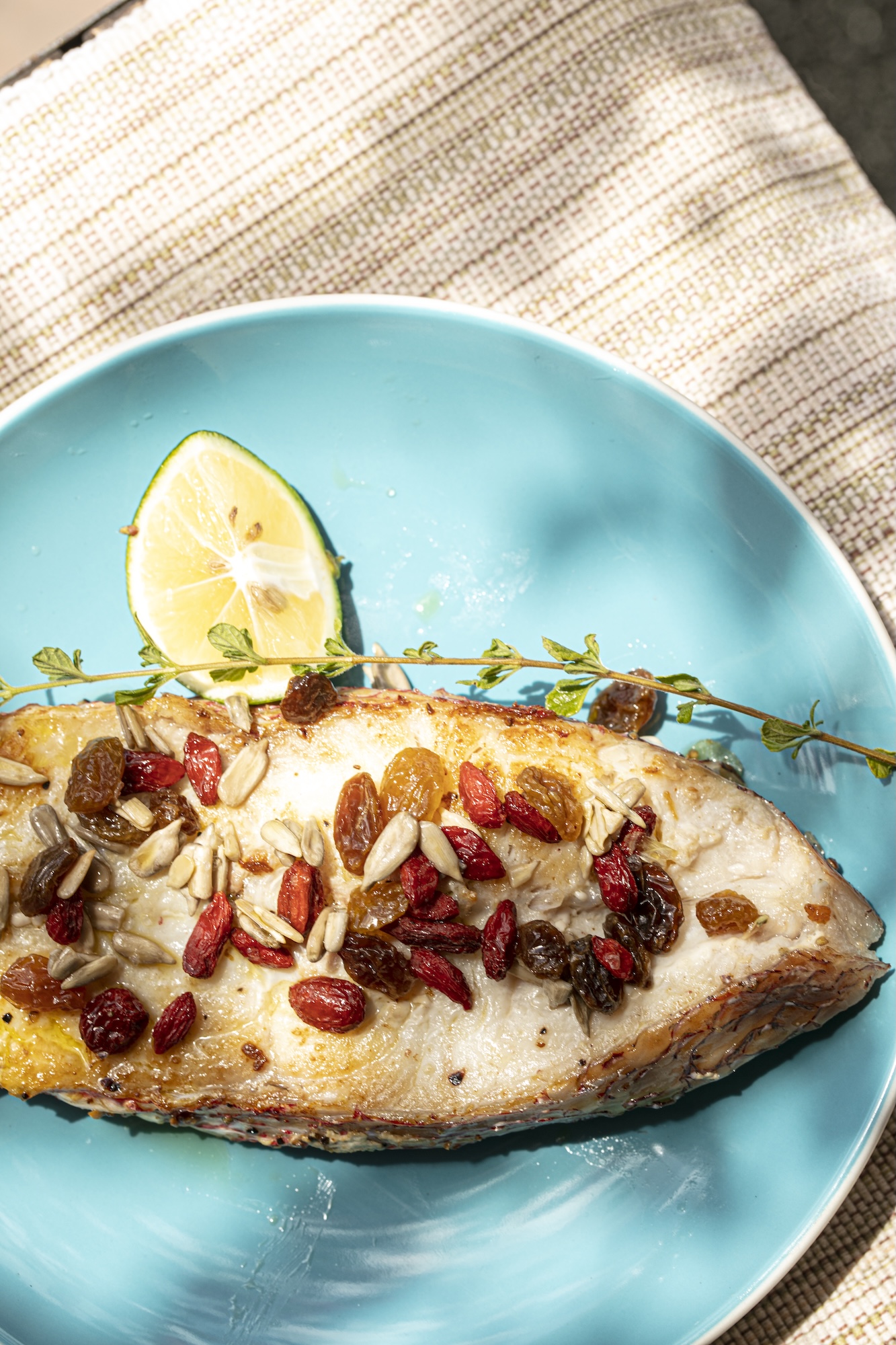 Top fish with nuts and berries for texture, extra flavor, and a myriad health benefits