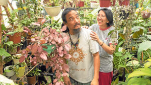 Bumbo and Arleen Villanueva at their plant-filled roofdeck