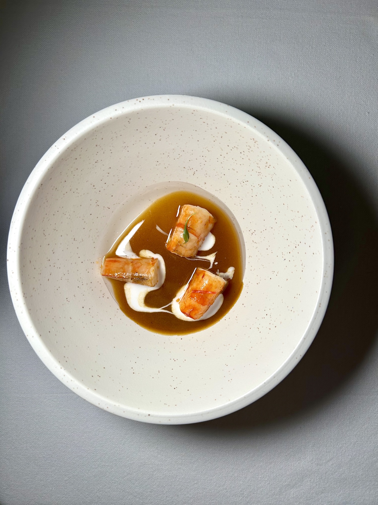 Langostina Curry (grilled king prawn curry with coconut water jelly, textured coconut milk, the essence of shrimp heads, and hints of coriander)