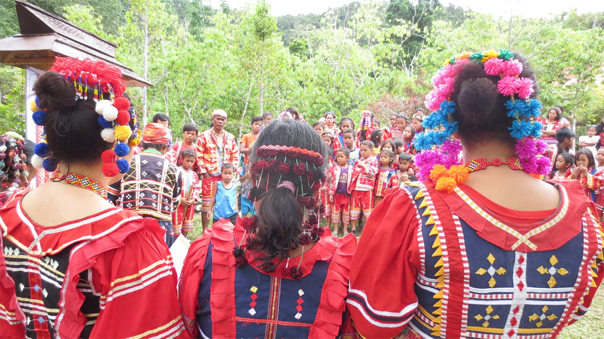 One of the author’s last coverages before moving on to podcasting was of a graduation of indigenous Matigsalug children deep in the mountains of Davao City. —CONTRIBUTED PHOTOS Twelve years ago, I was hauling old boxes in the middle of a dark, dusty garage, then digging inside them to find hundreds of affidavits belonging to the victims of martial law. I was a 24-year-old reporter, and it was my first year on the job. With a few of my editors and some interns, we scanned each document that had been stored in the home of one of the lawyers of these victims of human rights violations. These affidavits had been locked away for years, and we knew that we had to preserve history before these papers crumbled and were forgotten. I had learned about the Marcos dictatorship in school, of course. It was a time when our Araling Panlipunan teachers would still ask us if anyone had been born by 1986, and those who raised their hands were deemed special. We watched the “Batas Militar” documentary and my grade school mind latched onto the form of torture where the military would tear their victims’ nails out from their fingers. Going through the actual affidavits taught me many other forms of torment that were inflicted on the victims of the dictatorship: being made to brush one’s teeth with rose thorns; dragged through the mud where carabaos bathed with one’s neck tied with the same rope used on the beasts of burden; or ordered to climb a fruit tree someone had just been harvesting from before they were shot dead. These people were farmers, fisherfolk, carpenters, factory workers, businesspersons, nuns, housewives, teachers and students. They were from all over the country, speaking and eventually writing in their own regional languages. They had been left crippled, sickly or traumatized by the abuse they’d suffered. And if they had been one of the many who were summarily executed, their families were left wondering how justice could be served. We brought the copies of these affidavits around schools so that students could “meet” the victims and record their testimonies. It had become our mission to make people #NeverForget. Aside from this interactive activity, we also interviewed martial law survivors and published their accounts on our news site, as well as recorded live performances of living musicians of that time singing protest anthems from that era. People Power Four years later, our team embarked on another special project of remembrance. It was the 30th anniversary of the Edsa People Power Revolution, and as though it was happening in real time, we live-tweeted the events just as they unfolded in 1986. History had never felt more alive to me than when we were talking to our Twitter followers and keeping each other abreast of the developments as Feb. 25 neared. I was a digital-first reporter, and it was exciting for me to figure out how to use the newest platforms to tell stories. As our newsroom closed, I cofounded a podcast production company and dove headfirst into everything that went into creating audio narratives rooted in journalism. I honed my skills in interviewing so that my guests could weave pictures with words. I learned how to capture ambient sound. I tried my hand at cutting and putting audio, sound effects and music together using free software. I figured out how to write scripts so they sounded natural and not, well, scripted. I also became proficient in directing hosts who were just as new at podcasting as I was. Our team continued to commemorate what had gone before. We listened to mothers and wives talk about how their sons and husbands had been murdered by masked, motorcycle-riding men. They recalled where exactly on their loved ones’ bodies the bullets had pierced through, and how the victims had pleaded before they were gunned down. And just like the families of the martial law victims who had written their loved ones’ affidavits for them, they wondered why this had happened to them. ‘Tokhang’ Documenting the tales of “tokhang” included sitting in on an interview between a newspaper columnist I admired, Randy David, and his brother, now Cardinal Ambo David, as the two talked about the Christian view of redemption, the drug war, and former President Rodrigo Duterte. “[Duterte] is also a child of God?!” the older brother exclaimed, his disbelief reverberating through that tiny recording studio. And the reply of then Bishop Ambo, whose Caloocan diocese had turned into a killing field during Duterte’s anti-illegal drugs campaign, was simply, “Yes.” With the Philippine Daily Inquirer, we embarked on our first true-crime podcast. We wanted this to be narrative-style, and with the Inquirer’s library of newspapers spanning decades, as well as its current and former reporters and editors who had covered modern Philippine history as it unraveled, we were able to create two seasons. The first was “Super Evil: Hatched in Hell,” which was about the murder of one college student and the rape-slay of another in the 1990s, with a mayor as the mastermind. Before the pandemic lockdown, we visited the Laguna town where the crimes had taken place, and walked down a dirt path to where one of the victims’ bodies was found. We also talked to a few residents who still believed in the mayor’s innocence. We interviewed the lawyer of the family of one of the victims, victims as well . “In the courtroom, the mayor would whisper to me and ask what color I wanted my coffin to be,” recalled the lawyer. More than 20 years after the entire affair, the lawyer was finally able to laugh it off. “That’s how fierce he was.” Political patronage We also talked to a governance expert who explained why the same mayor’s family members continued to get elected into power term after term: political patronage. Vote for me and I will help you. And if I help you, you owe me a debt of gratitude, so you must continue to vote for me. As long as there was inequality in society, there would always be those who had none and would seek help from those in power. Whether or not these people were worthy of being in that position was the question . Our second season, “Super Evil: Such a Beautiful Place to Die,” was also deeply political. In 2009, when the convoy of the Mangudadatus and the reporters who had accompanied them to file Esmael “Toto” Mangudadatu’s certificate of candidacy was intercepted by the Ampatuans and their private army, the victims were led to a hilly spot where they were executed, then buried in shallow graves with a backhoe. “A beautiful place to die,” a journalist who had gone to the massacre site remarked. Though we did not have the budget to fly to Maguindanao and see it for ourselves, we were able to talk to one of the journalists who was part of the investigating team that had responded within hours of the incident. “Is it obvious that it left an emotional toll on me?” she asked in between sniffles. “It’s been 10 years and I still cry about it. ” She went to wake after wake to find out who the victims were, which news agencies they had come from, and whether there were children that they needed to find support for so that the kids could continue schooling. There were spouses who had no idea how dangerous their partners’ work had been, and they needed to be consoled as well. “That was the year when there was no Christmas,” the journalist told us in the recording studio. Closing that chapter After five years, I closed that chapter in my journalism career and spent a few months figuring out what else I wanted to do with my life. It had been a fast-paced decade, with coverages of typhoons where my story count would be 12 at the end of the day; “pinatapon lang doon” (shipped off to an unfamiliar beat) assignments where I tried to figure out which words to use for the clothes on display during Philippine Fashion Week; a trip to Benham Rise which found me lying on the floor, seasick, by day two, and on the same night, lying on the deck of the ship, watching the moonless sky and imagining the creatures that swam in the waters around us. Many YouTube videos had been consumed over that career break. This number was directly proportional to the amount of naps I took with my dog on the couch. I had time to watch the birds flit through the huge tree in our neighbor’s yard and study the way the light dappled the leaves. I tried doing work with a few nongovernmental organizations, one on building climate resilience among marginalized communities, and another on monitoring the peace process in the Bangsamoro. But it was the third one, a Canadian media development organization, that really felt like home. Human rights defenders When the Journalists for Human Rights (JHR) team arrived in Manila in November last year, I arranged meetings in cafés and restaurants with human rights defenders and members of mainstream media and the alternative press. They were aghast at the imprisonment of young community journalist Frenchie Mae Cumpio on charges of illegal possession of firearms and explosives. They were baffled by the practice of Red-tagging, where journalists critical of the government were branded as aligned with Communist rebels, placing them in danger of surveillance, harassment and even death. And they were in awe at how their Filipino colleagues continued to do their jobs despite the challenges they faced. Throughout these conversations we realized that everyone should have been mic-ed up. And by the time JHR had flown back to Canada, we were determined to create a podcast. Almost a year later, with veteran broadcast journalist Lisa LaFlamme recording in Toronto and myself doing interviews in Manila, with the guidance of JHR executive director Bill Killorn and programs manager Mujtaba Haris, and with the help of my coproducer and audio editor Nina Torralba, we have launched the Journalists for Human Rights Podcast, and its first season centers on the Philippines. And here, I find myself still in the business of preserving memory. But this time, it’s of the people who themselves are in the same business, and have been for decades before me. Such as my mentor and former managing editor Lourdes Fernandez, who had been part of the mosquito press and continues to lead a newsroom during the time of Marcos Jr . I asked, “What keeps you going?” She replied, “Many years ago, I was in Mexico talking with one of the officers of the Mexican chapter of the International Organization of Journalists. She was kind of old already, but she was driving a car and bringing us around. At that time, there were a lot of journalist killings by the drug cartels in Latin America. She said, ‘How would you know when it’s time to retire?’ And then I said, ‘Well, when the day comes when there’s news and then I don’t jump up anymore.’ And then she said, ‘Yeah, me too.’ All of a sudden, we saw the tabloids on the street saying, ‘Princess Diana has died.’ She applied the brakes so hard. Her tiny car screeched to a crazy halt. She said, ‘Wait, wait!’ And then we ran out of the car to buy the newspaper.” —CONTRIBUTED INQ