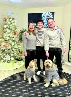 Loise, David, and J.R. Basa and their dogs Ozzy and Maple at Christmastime in Chicago —CONTRIBUTED PHOTOS