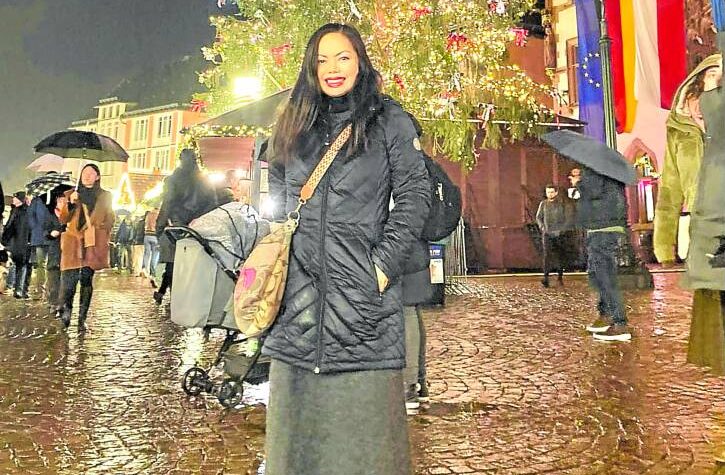 Yasmine Hidalgo-Giovannoli poses in front of a Christmas tree in Germany. —CONTRIBUTED PHOTO