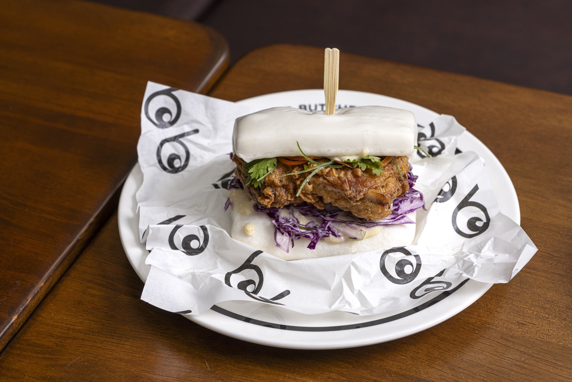 Fried chicken bao with yuzu kosho mayo and apple and cabbage slaw