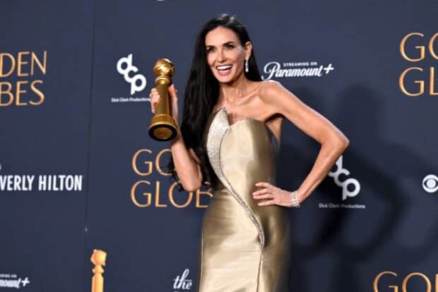 US actress Demi Moore poses with the Best Performance by a Female Actor in a Motion Picture ñ Musical or Comedy award for "The Substance" in the press room during the 82nd annual Golden Globe Awards at the Beverly Hilton hotel in Beverly Hills, California, on January 5, 2025. (Photo by Robyn Beck / AFP)