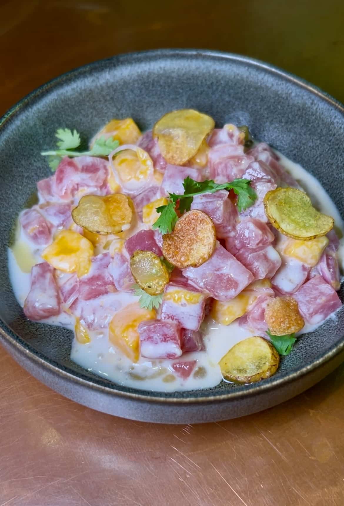 This tuna ceviche is an homage to their Filipino roots with flavors of lemongrass, coconut, and mangoes