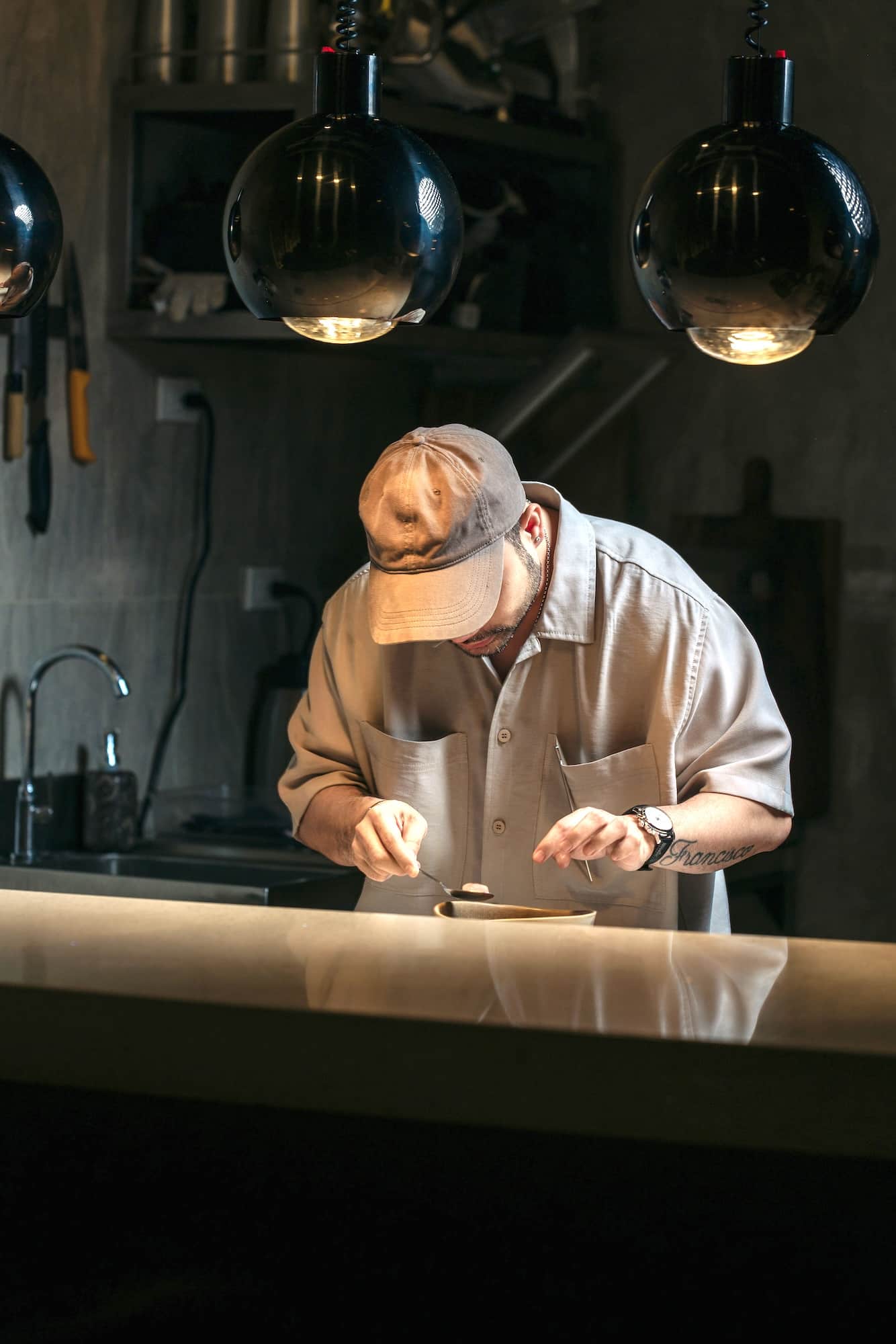Francis Tolentino at work in the Taupe kitchen