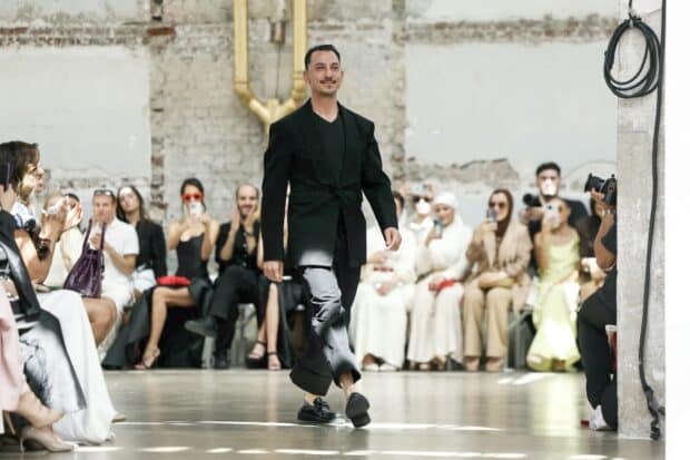 Syrian fashion designer Rami Al Ali acknowledges the audience following the presentation of his creations during the Women's Haute-Couture Fall/Winter 2025-26 collection show in Paris, on July 10, 2025. (Photo by Thomas SAMSON / AFP)