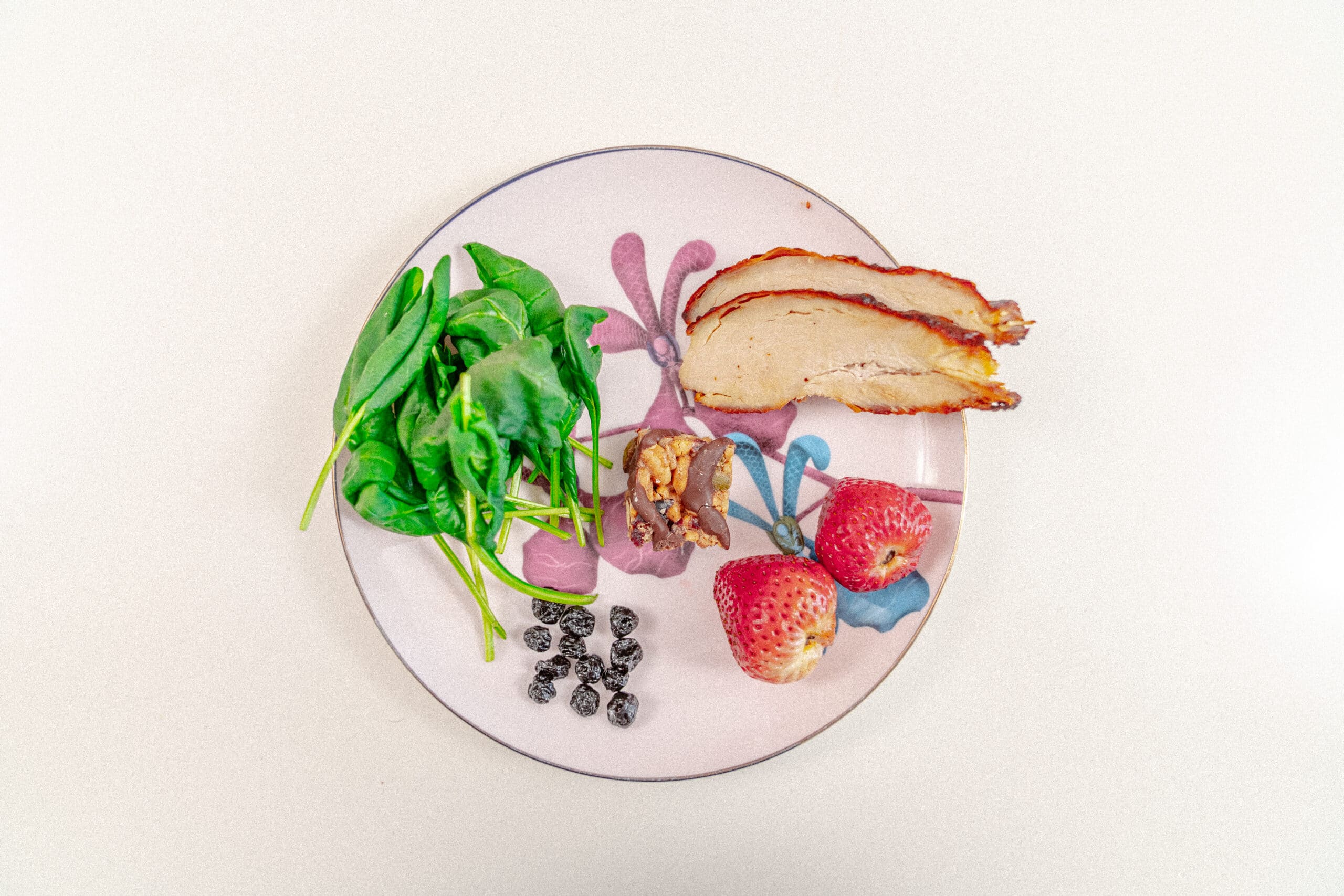Baby spinach, chicken strips, strawberries, dried blueberries, granola bar