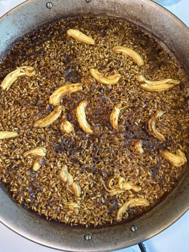 Dry rice with espardenyes and langoustine broth
