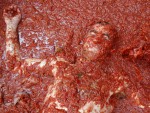 Squashed tomato battle paints Spanish town red